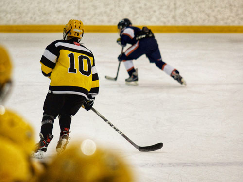 Young hockey players competing on the ice